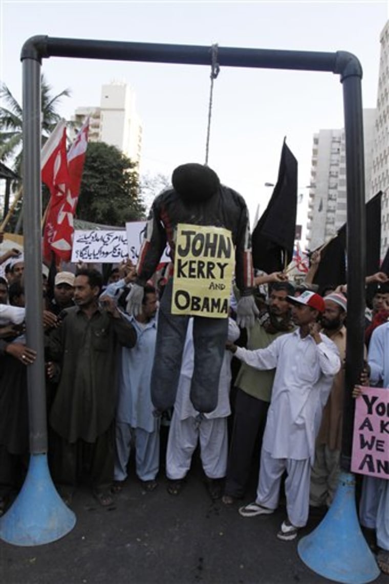 Supporters of Pakistani religious party Jammat-e-Islami hang an effigy during a protest against the visit of U.S. Sen John Kerry and a statement by U.S. President Obama regarding release of a U. S. consulate employee Raymond Davis.